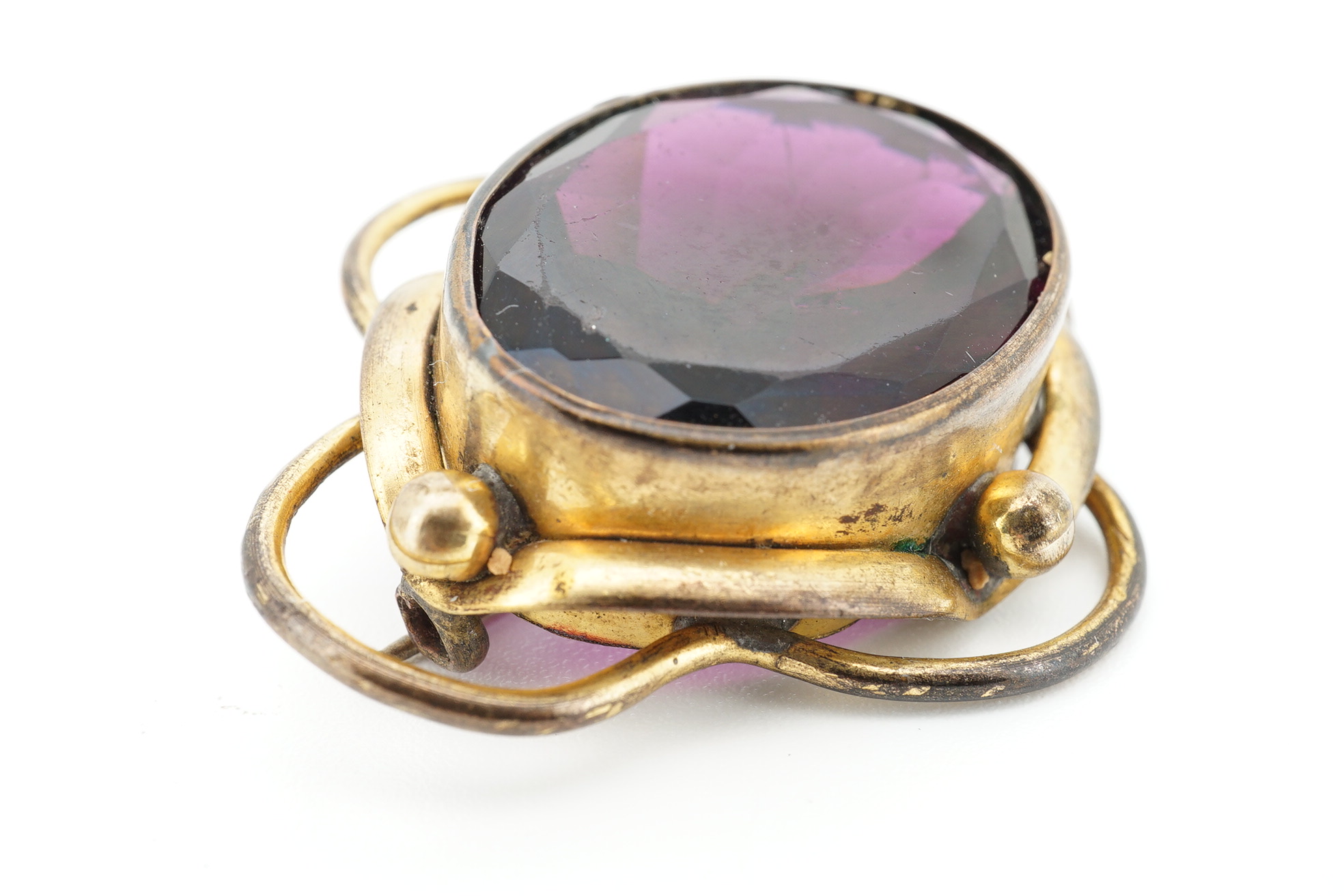 Two Victorian pinchbeck and amethyst paste set brooches, largest 62mm, together with three other items including a cameo shell brooch, tortoiseshell pique brooch and an agate mounted pill box. Condition - poor to fair